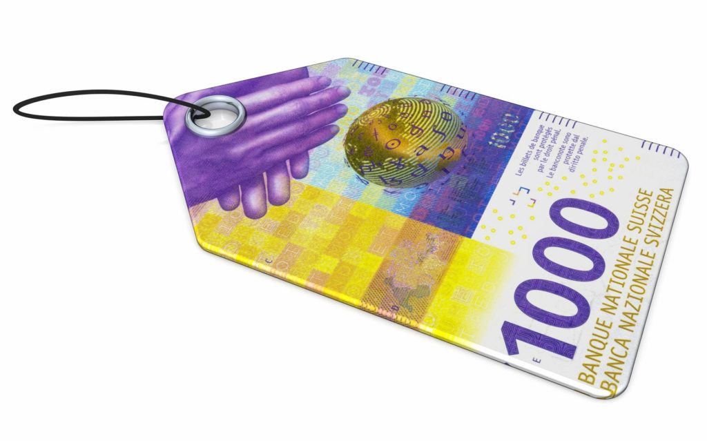Colourful Swiss banknote design featuring a globe and geometric patterns for security.