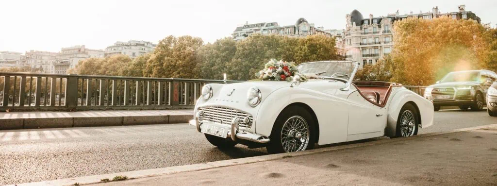 Classic vintage convertible car decorated with flowers.