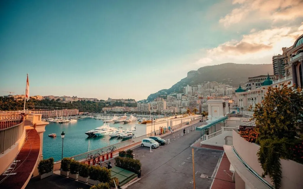 Luxurious marina with yachts and hillside cityscape in Monaco.