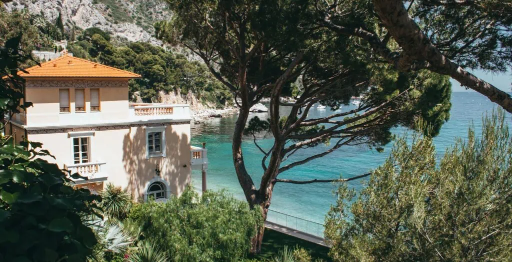 Seaside luxury villa with scenic ocean views and lush greenery near the coast.