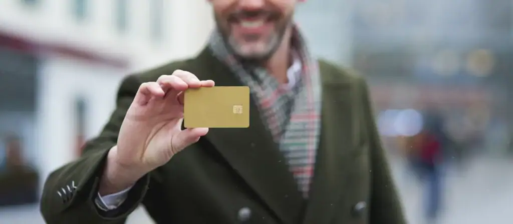 Man with a gold card in his hand