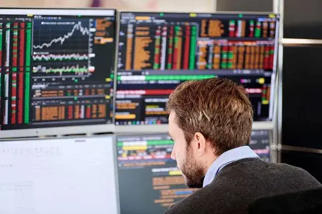 Sophisticated trading desk with financial market analytics and stock data analysis.
