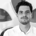 Portrait of a man in a white shirt at Alpen Partners office.